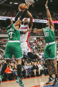 Jared Sullinger (left) blocking the Piston's Greg Monroe.